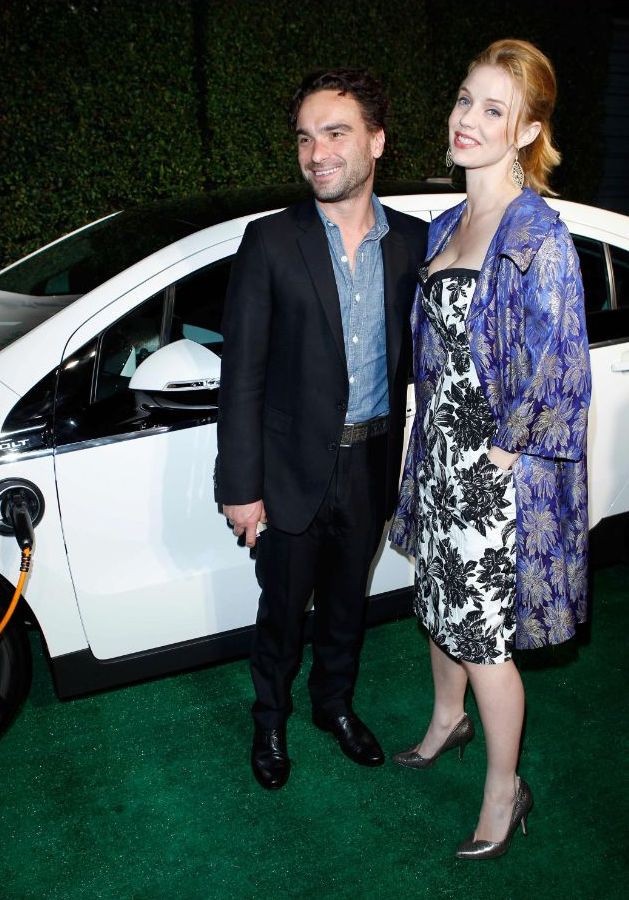 Actors Johnny Galecki L and Kelli Garner on the green carpet with a 2012 